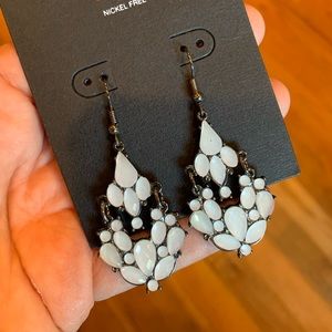 White dangling earrings